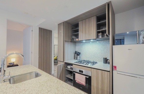 Carlton South Apartment | Walk through the art-filled lobby, neighbour to the world-renowned Royal Melbourne Institute of Technology (RMIT).
