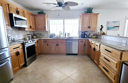 Laguna Shores House | WALK TO BEACH, PRIVATE FAMILY AND PET FRIENDLY POOL HOME ON A CANAL