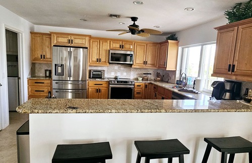 Laguna Shores House | WALK TO BEACH, PRIVATE FAMILY AND PET FRIENDLY POOL HOME ON A CANAL