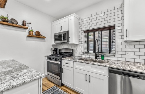 Holly Apartment | Walk to downtown Holly from this newly renovated historic apartment!