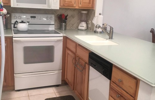 Capri Isle Condo | Walk to the Beach! Waterfront furnished condo in perfect location!