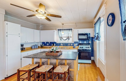 Colchester House | Warm & inviting retreat with a full kitchen, gas fireplace, & furnished patio