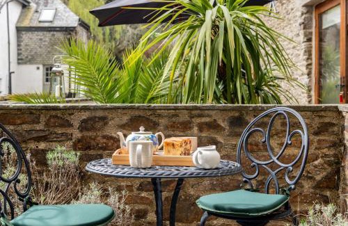 Widegates House | Water Mill at East Trenean Farm -Luxury Cornish Cottage sleeping 4 with hot tub, private garden, rural views and EV facilities