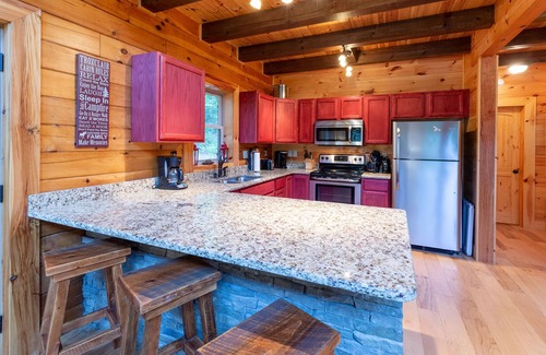 Tuckasegee Cabin | Waterfall Hideaway-Spacious Streamside Cabin in Lake Community w/Hot Tub & Kayak!