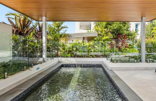 Bokarina Apartment | Waterfront 2-Bed Oasis - Pool Steam Jacuzzi Gym