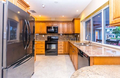 Garden Isles House | Waterfront - Beach, Heated Pool, Hot Tub, Kayak and SUP's