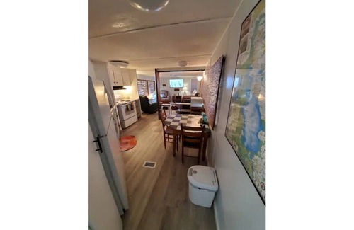 Satsuma Cottage | Waterfront Boat House updated mobile home - Work & Fish on 50 ft. Dock and slips