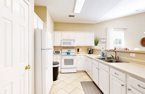 Sunset Beach Condo | Waterfront condo with pool, tennis, bikes & lagoon/golf views - near the beach
