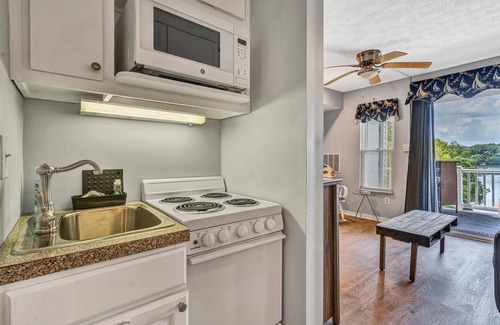 North Shore Condo | Waterfront condo with lake-view deck, tennis court & pool - dog-friendly