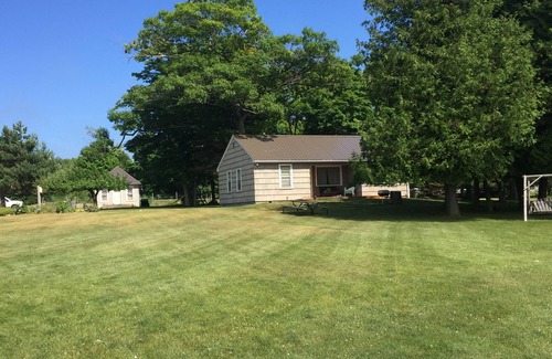 Washington Island Cottage | Waterfront cottage on Detroit Harbor. Beautiful beach and dockage.