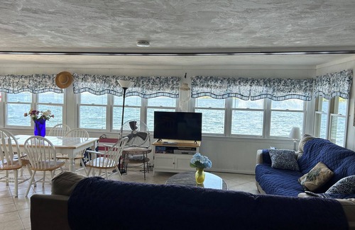 Laconia House | WATERFRONT HOME BOAT HOUSE BOAT SLIPS PANORAMIC LAKE AND GUNSTOCK MOUNTAIN VIEW