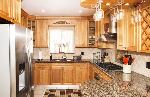Garden Isles House | Waterfront Home, Large Heated Pool, 5 min. from the beach, family friendly