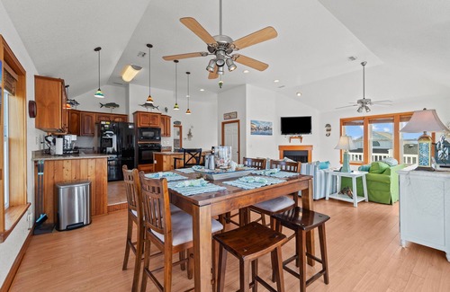 Frisco House | Waterfront home with boat dock, shared pool, & balcony with ocean view