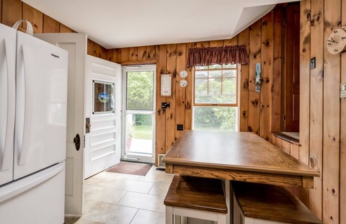 Melvin Village House | Waterfront home with boat dock, screened-in porch, large deck
