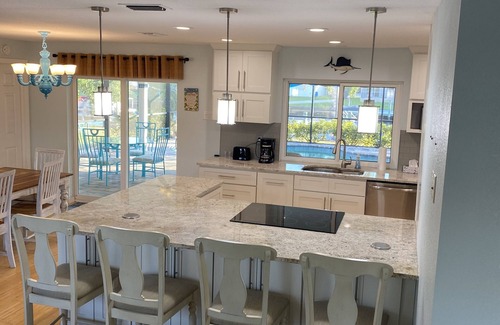 Edgewater House | Waterfront house, boat dock, pool, walking distance to Port Charlotte Beach
