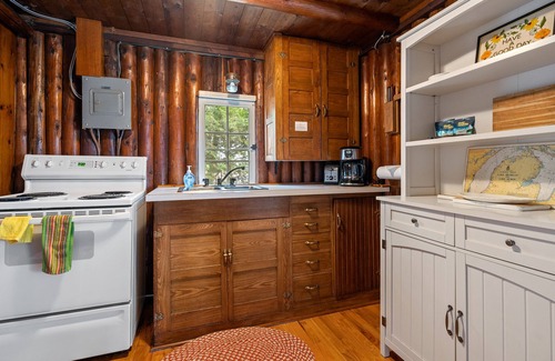 Sturgeon Bay Cottage | Waterfront Log Cabin | Sunset Views, Fire Pit, Screened Porch