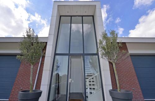 Kamperland Apartment | Waterfront penthouse with roof terrace and private jetty