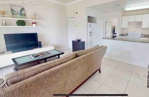 Grand Harbour Condo | Waterfront Sanctuary Cove, 2Bed 2Bath, King Bed, Pool, Porch at Grand Harbour.