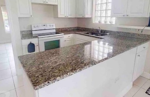 Grand Harbour Condo | Waterfront Sanctuary Cove, 2Bed 2Bath, King Bed, Pool, Porch at Grand Harbour.
