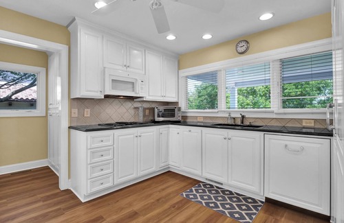 Shell Island House | Waterfront Retreat steps from Beach Access, 2 Boat Slips, Hot Tub & Elevator