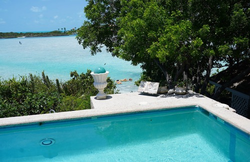 Ocean Point Villa | Waterfront villa offers white sandy beach and easy seaside access.