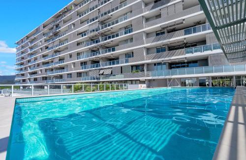 Cairns Central Business District Apartment | Waters Edge at Harbour Lights - Poolside Convenience