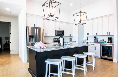 Pelican House | Waterside, Heated Saltwater Pool and Spa with Modern, Florida charm.