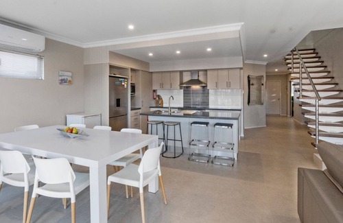 Exmouth House | Wave - Modern Villa on the Exmouth Marina with boat mooring.