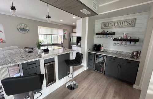 South Island House | WE ARE BACK! NEWER POOL/SPA and Walk to beach! Totally updated Canal front home!