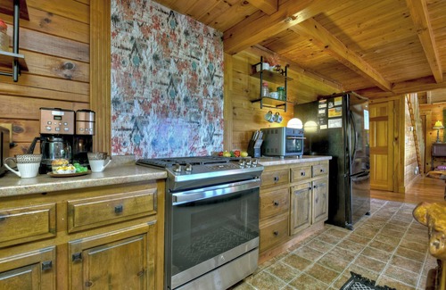 Walnut Mountain Cabin | Welcome to Starlight Mountain: Pet-friendly haven boasting stunning mountain views, hot tub, fire-table, pool table, and reliable WiFi