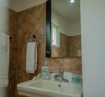 Half Moon Bay Apartment | West End Inn Beachfront Hotel Room in West End