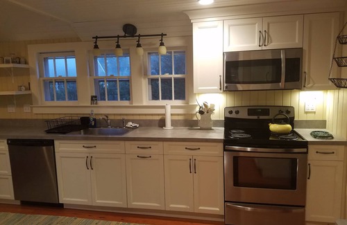 Quioque House | Westhampton quintessential waterfront 2 acres w/tennis, dock.