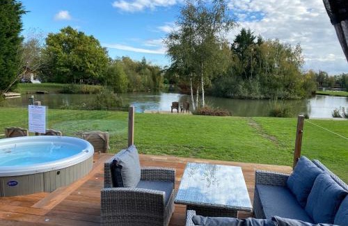 Tattershall House | Widgeon Bespoke Cabin is lakeside with Private fishing peg, hot tub situated at Tattershall Lakes Country Park