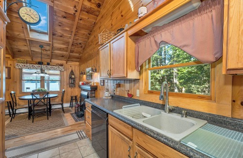 Moultonborough House | Winnipesaukee Lake Front Cottage with Sandy Beach and 25ft Dock Sleeps 8