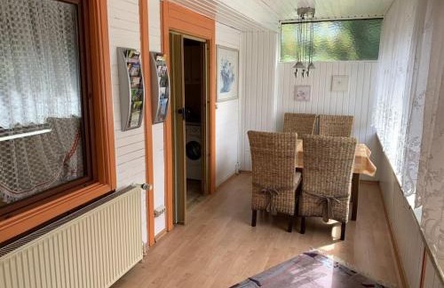 Waldsiedlung Romerstraße House | Wooden holiday home with winter garden