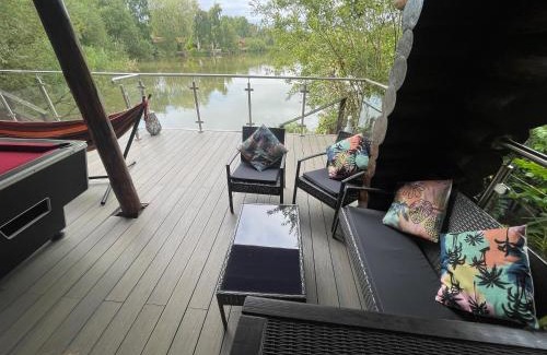 Tattershall House | Woodpecker Log Cabin with hot tub, pizza oven bbq entertainment area, lakeside with private fishing peg situated at Tattershall Lakes
