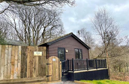 Llanybri Ski Chalet | Wren 23-Hot Tub-Woodland Lodges-Tenby-Pembroke
