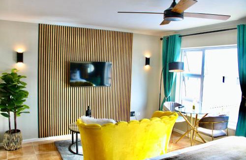 Strand Apartment | Yellow Couch Studio Apartment 1 KingBed