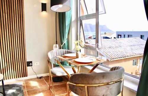 Strand Apartment | Yellow Couch Studio Apartment 1 KingBed
