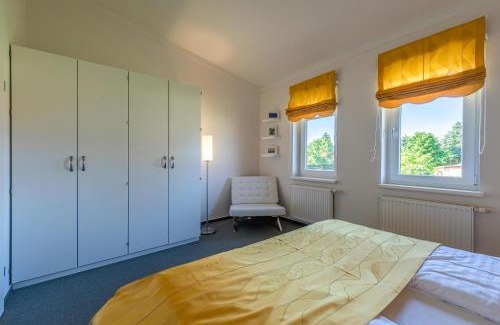 Muritz Apartment | Zwergtaucher - Ferienwohnung mit Balkon, Seeblick & Freizeitangeboten am See