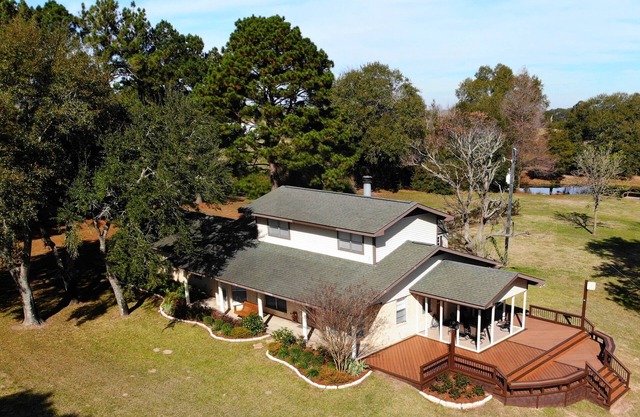 100-acre ranch with beautiful creek, ponds, woods, livestock