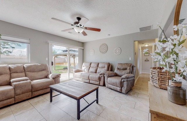 3 Bedroom (1 King 2 Queen beds) 1 bathroom home with private backyard