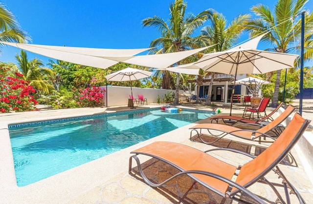 A Beautiful private Beach House w/Large Pool, surrounded By Palms & Flowers