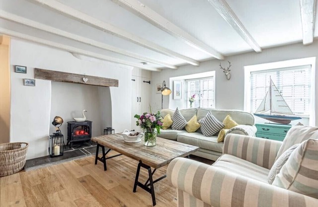 A renovated 300 year old Thatched cottage in the heart of a pretty village.