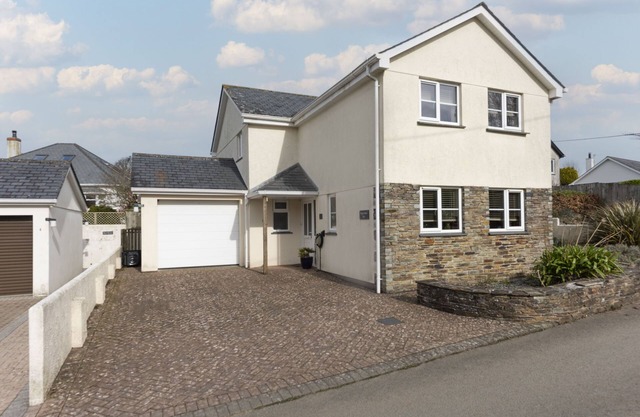 A spacious, detached four-bedroom holiday home just a mile from the beach.
