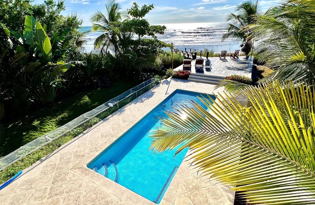A true beachfront home on a surf break
