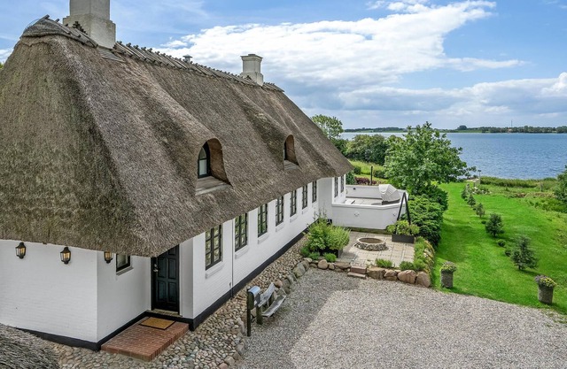 A unique gem of a vacation home located in a scenic setting right on the water.
