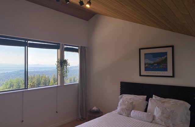 A VIEW FROM EVERY ROOM! A PEACEFUL, NATURAL SETTING WITH A HOT TUB!