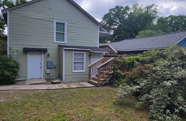 Adorable cottage in lovely gated property on beautiful Elm lined main street