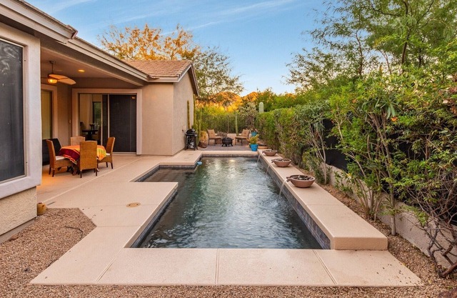 Adorable four bedroom, three bath private home with sparkling blue pool.
